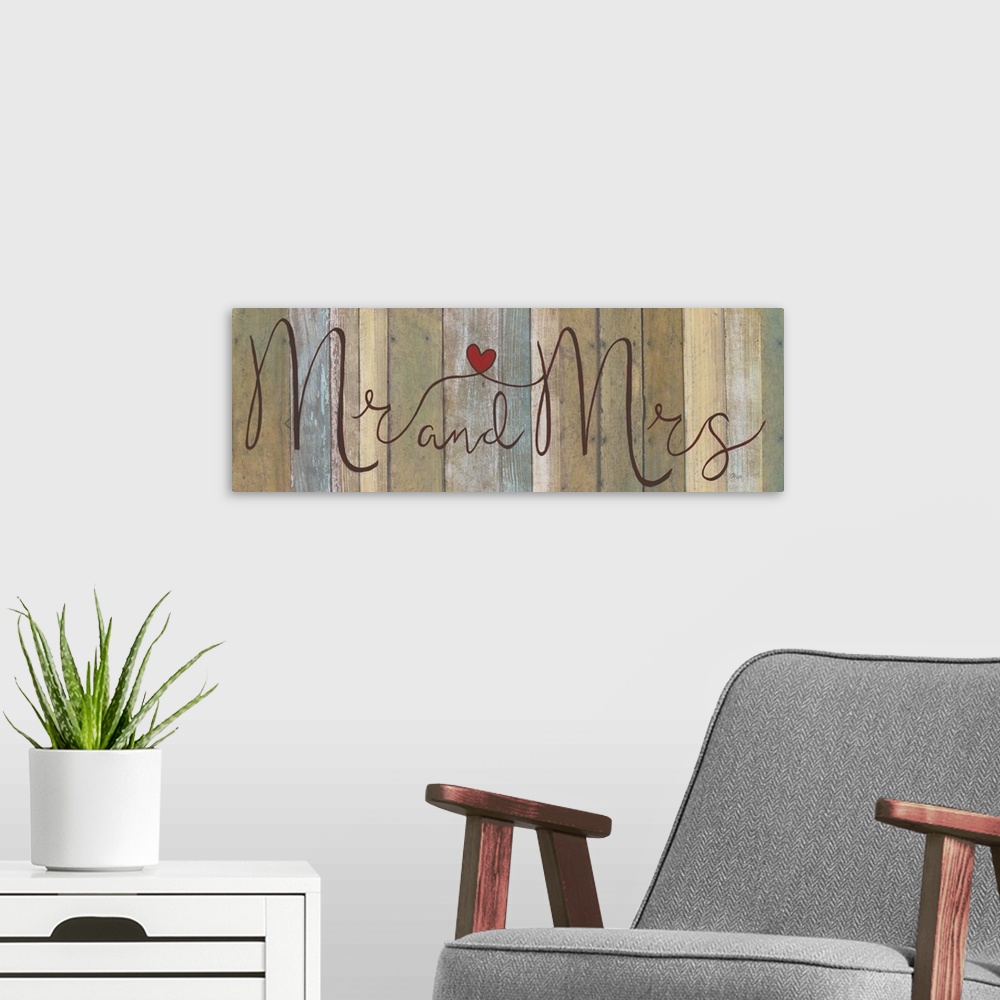 A modern room featuring ?Mr and Mrs? painted in cursive on a multicolored wood background with a red heart connecting in ...