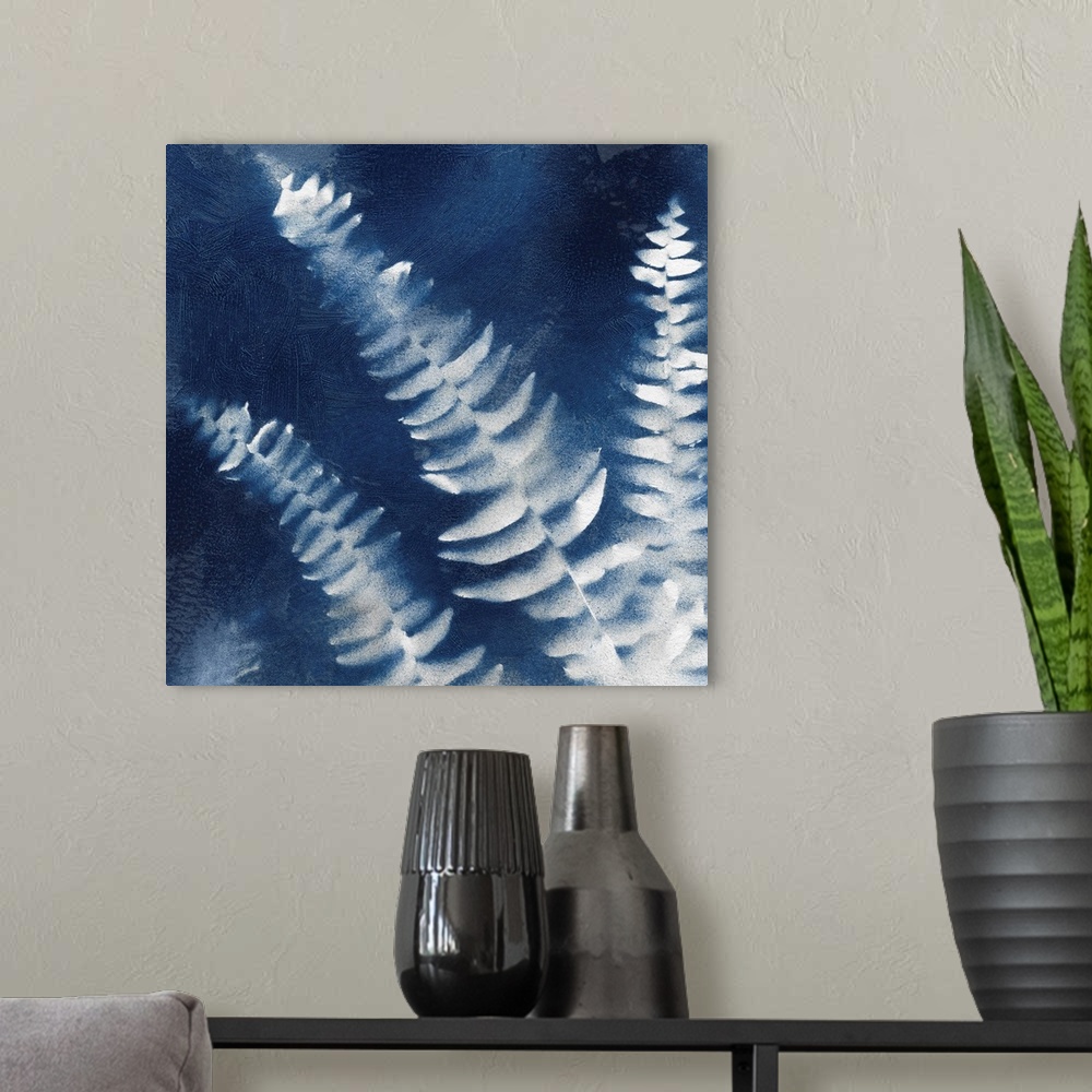 A modern room featuring Square indigo painting of white silhouettes of fern leaves.
