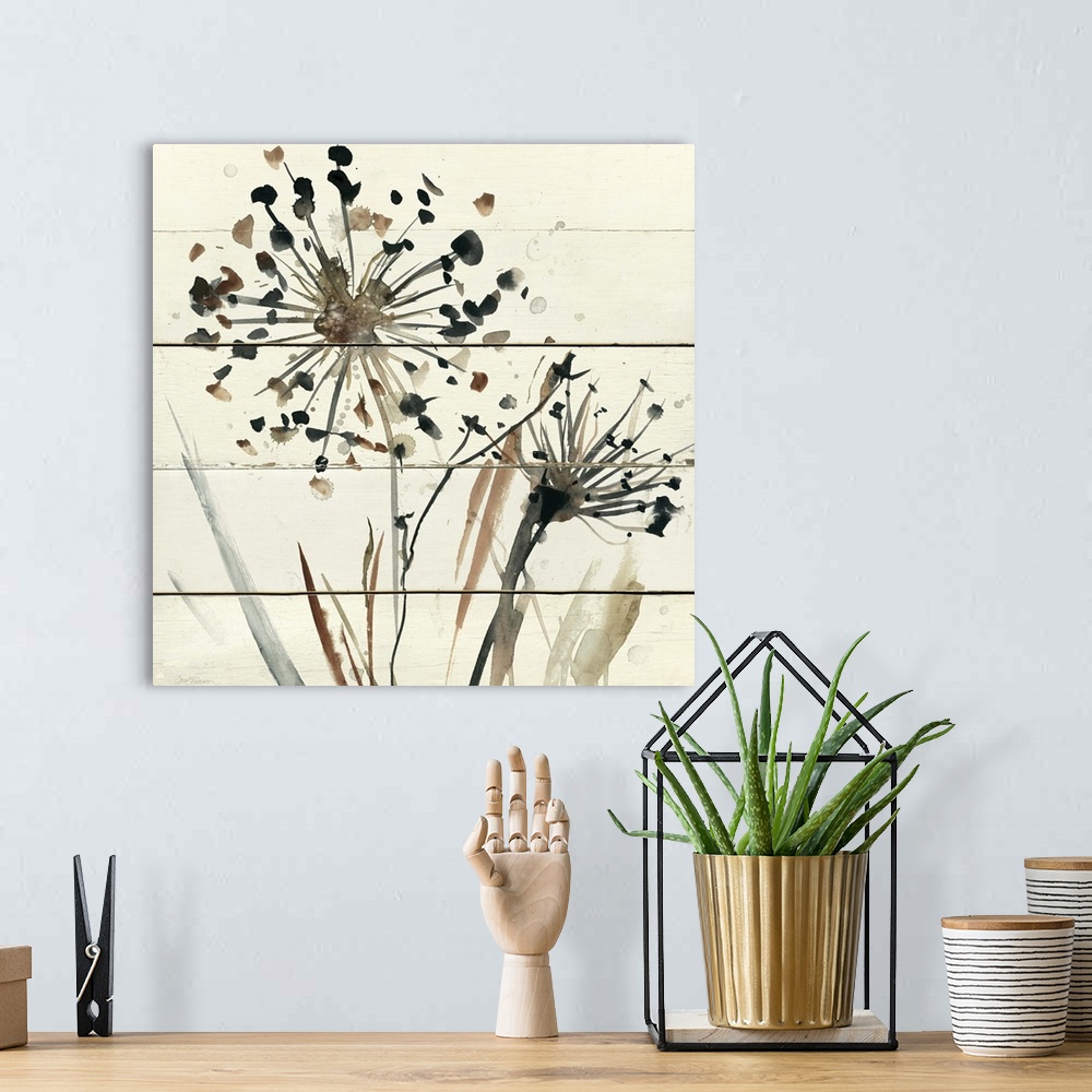 A bohemian room featuring Square abstract watercolor painting of neutral toned dandelions on a white wood paneled background.