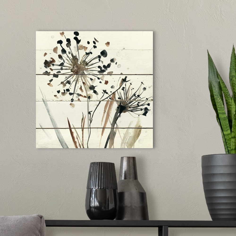 A modern room featuring Square abstract watercolor painting of neutral toned dandelions on a white wood paneled background.