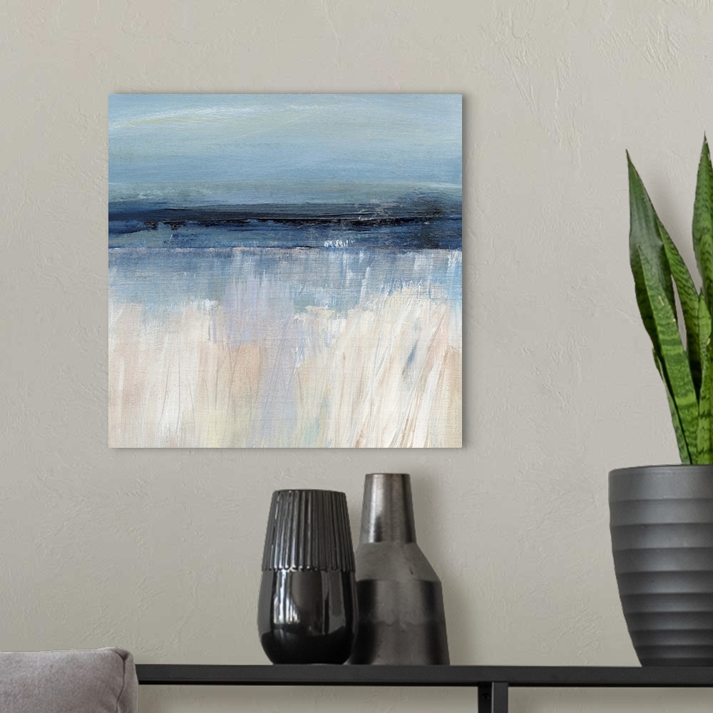 A modern room featuring Square abstract painting of a seascape with the sandy beach at the bottom and the ocean and sky a...