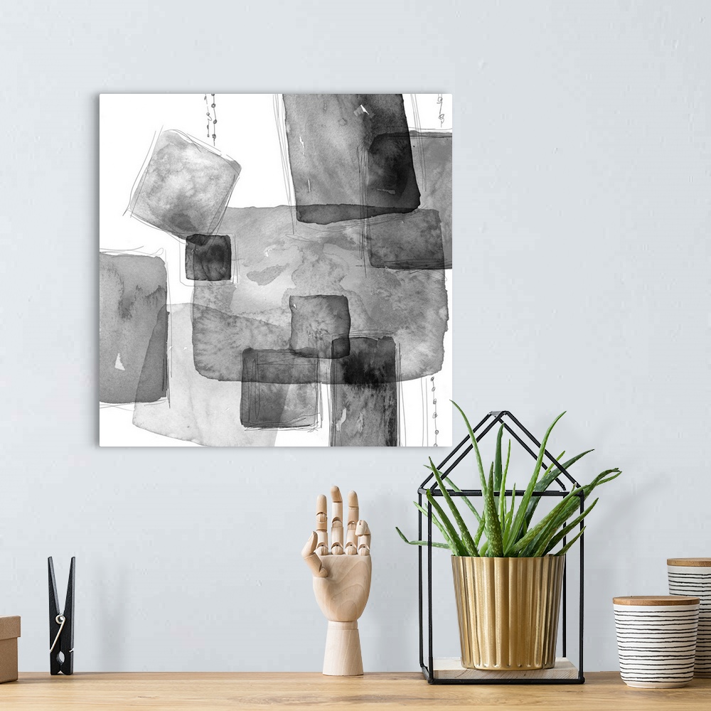A bohemian room featuring Abstract watercolor painting of square shapes in shades of grey.