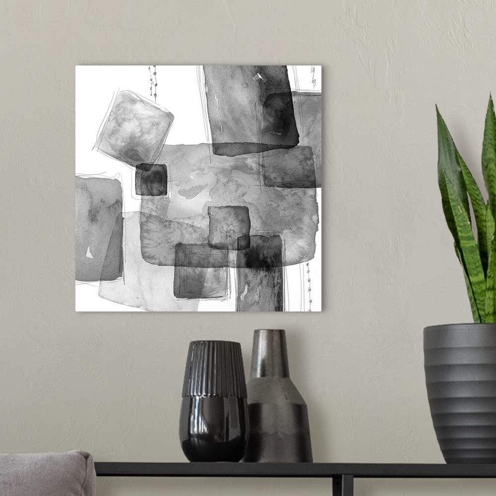 A modern room featuring Abstract watercolor painting of square shapes in shades of grey.