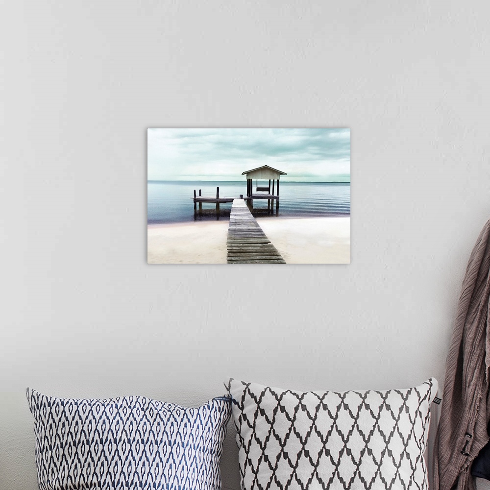 A bohemian room featuring Photograph of pier stretching into a peaceful ocean and beach.