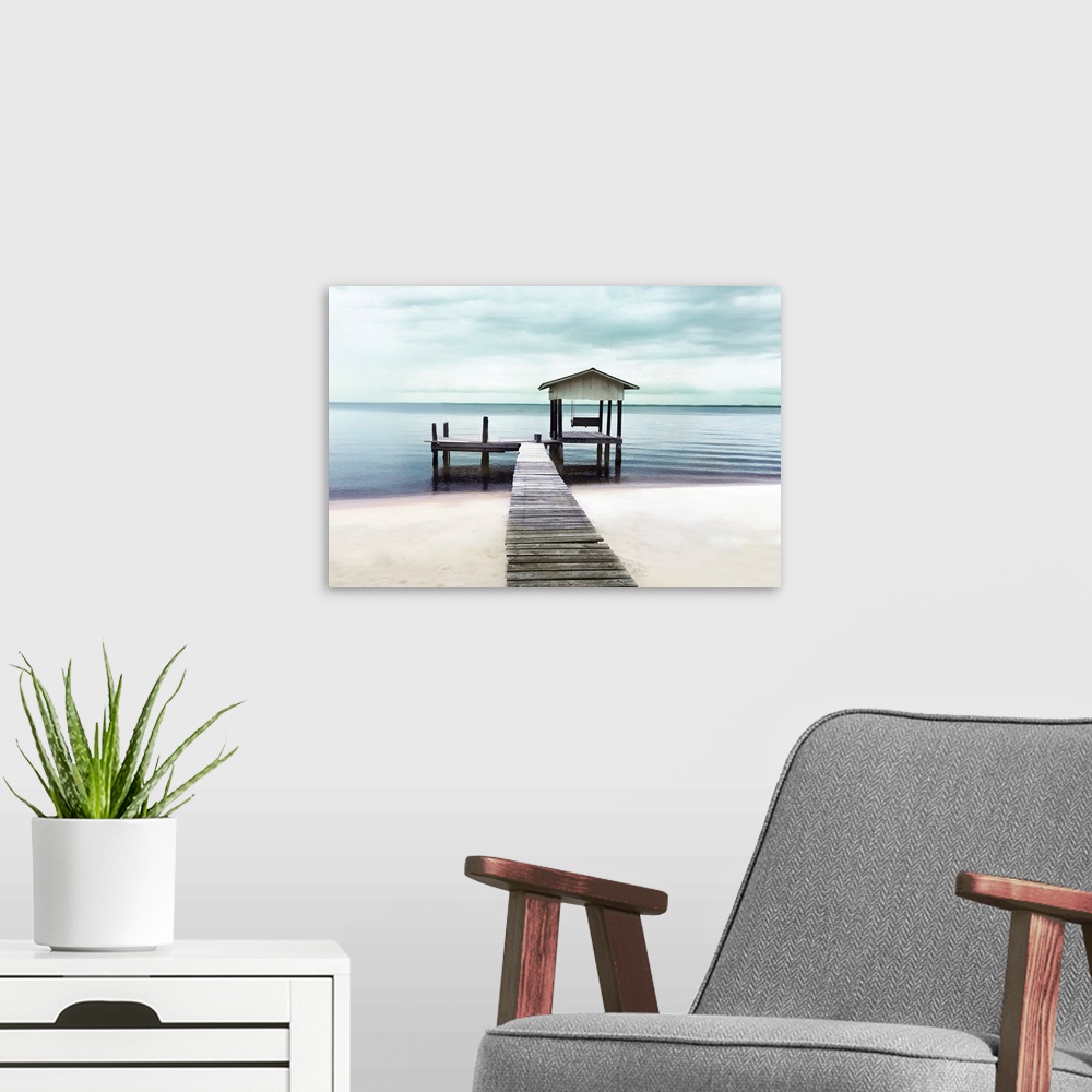 A modern room featuring Photograph of pier stretching into a peaceful ocean and beach.