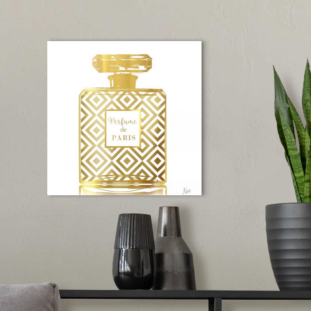 A modern room featuring Fashionable square decor with a metallic gold Perfume de Paris bottle on a white background.