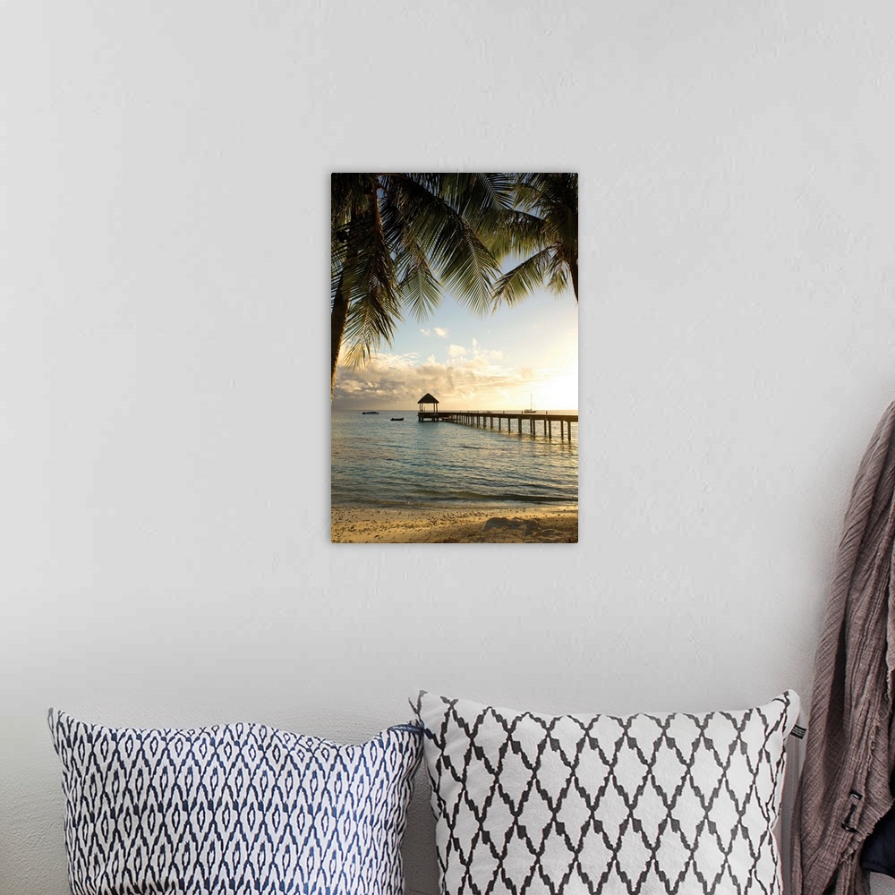 A bohemian room featuring Vertical photograph of a tropical landscape framed with palm trees on both sides and a long pier ...