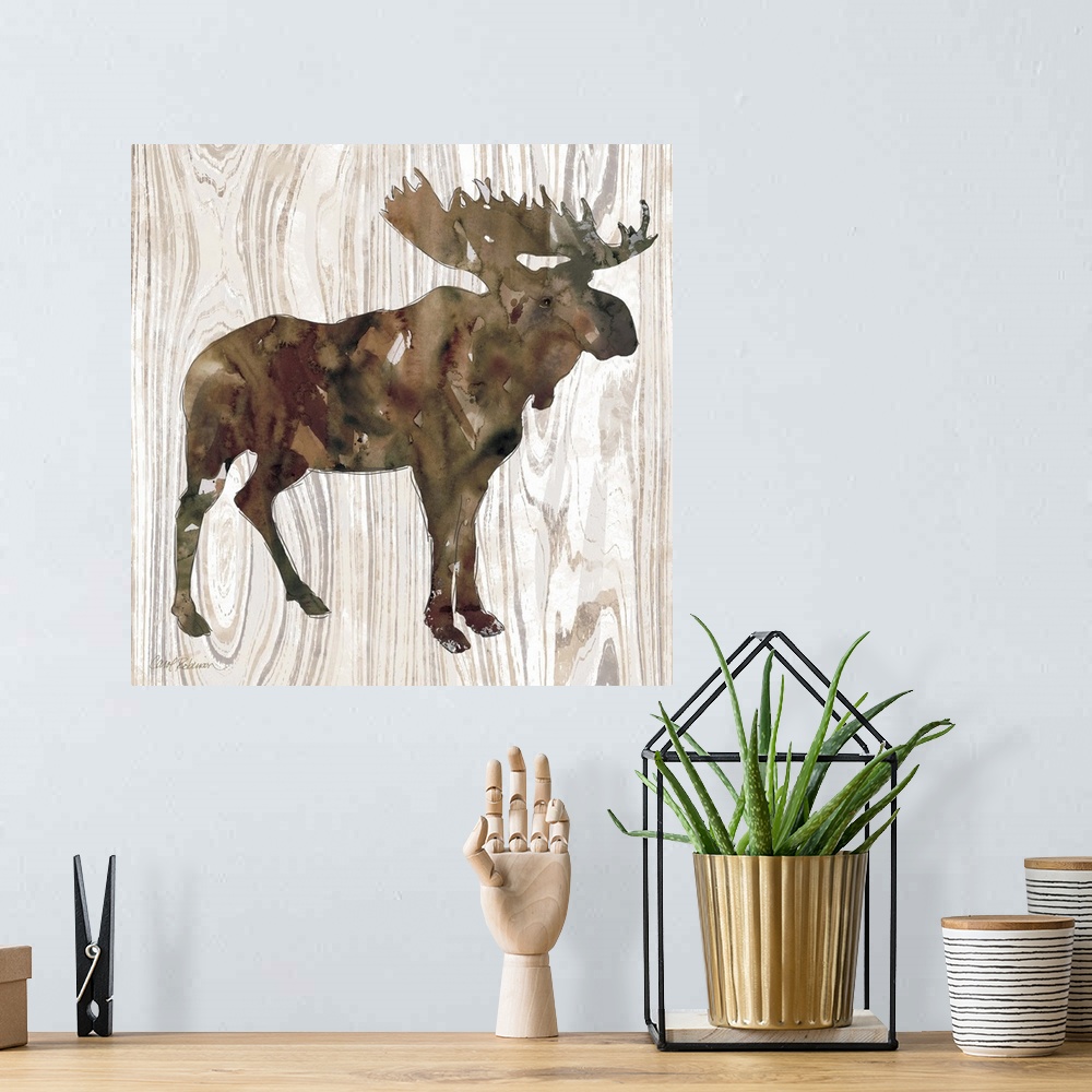 A bohemian room featuring Watercolor silhouette of a moose on a wood-grain pattern.