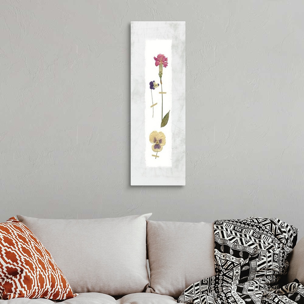 A bohemian room featuring Panel decor with dried flowers pressed onto a painted white rectangle on a marble-like background.
