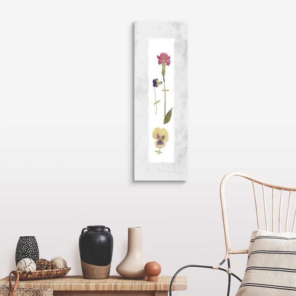 A farmhouse room featuring Panel decor with dried flowers pressed onto a painted white rectangle on a marble-like background.