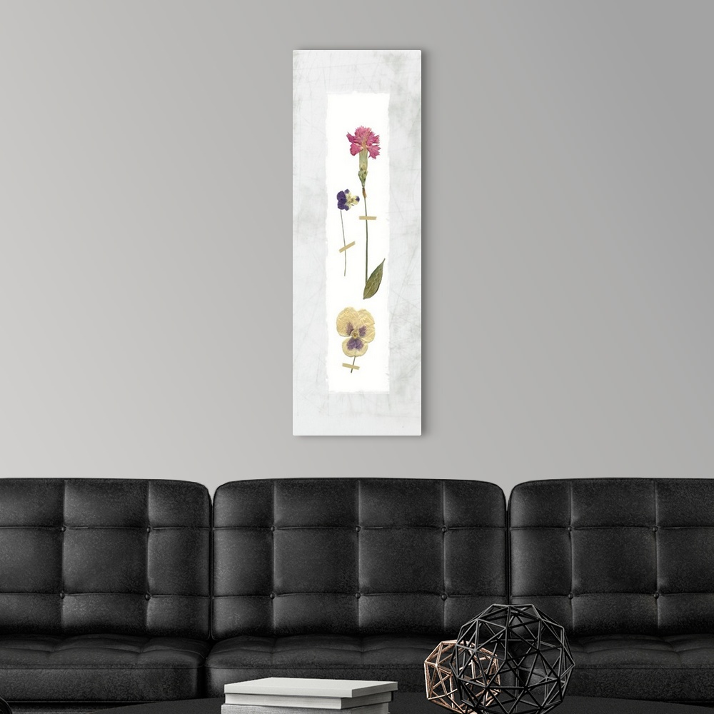 A modern room featuring Panel decor with dried flowers pressed onto a painted white rectangle on a marble-like background.