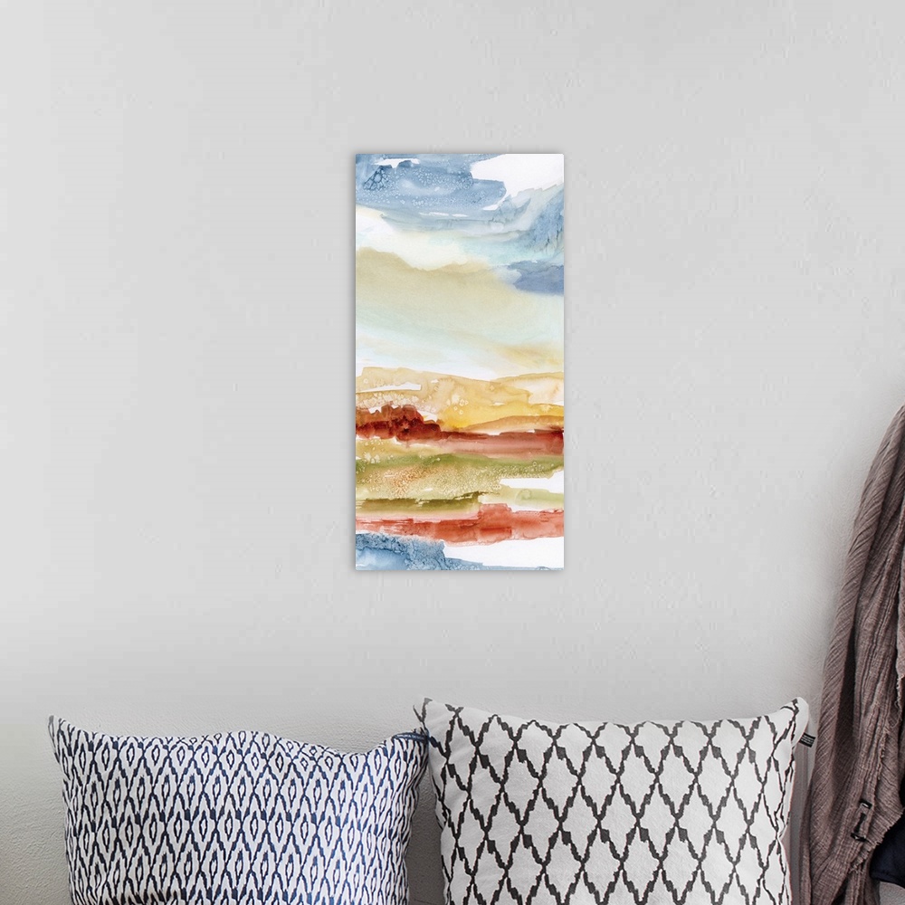A bohemian room featuring Abstract watercolor painting in blue, red, and orange, resembling a desert landscape.