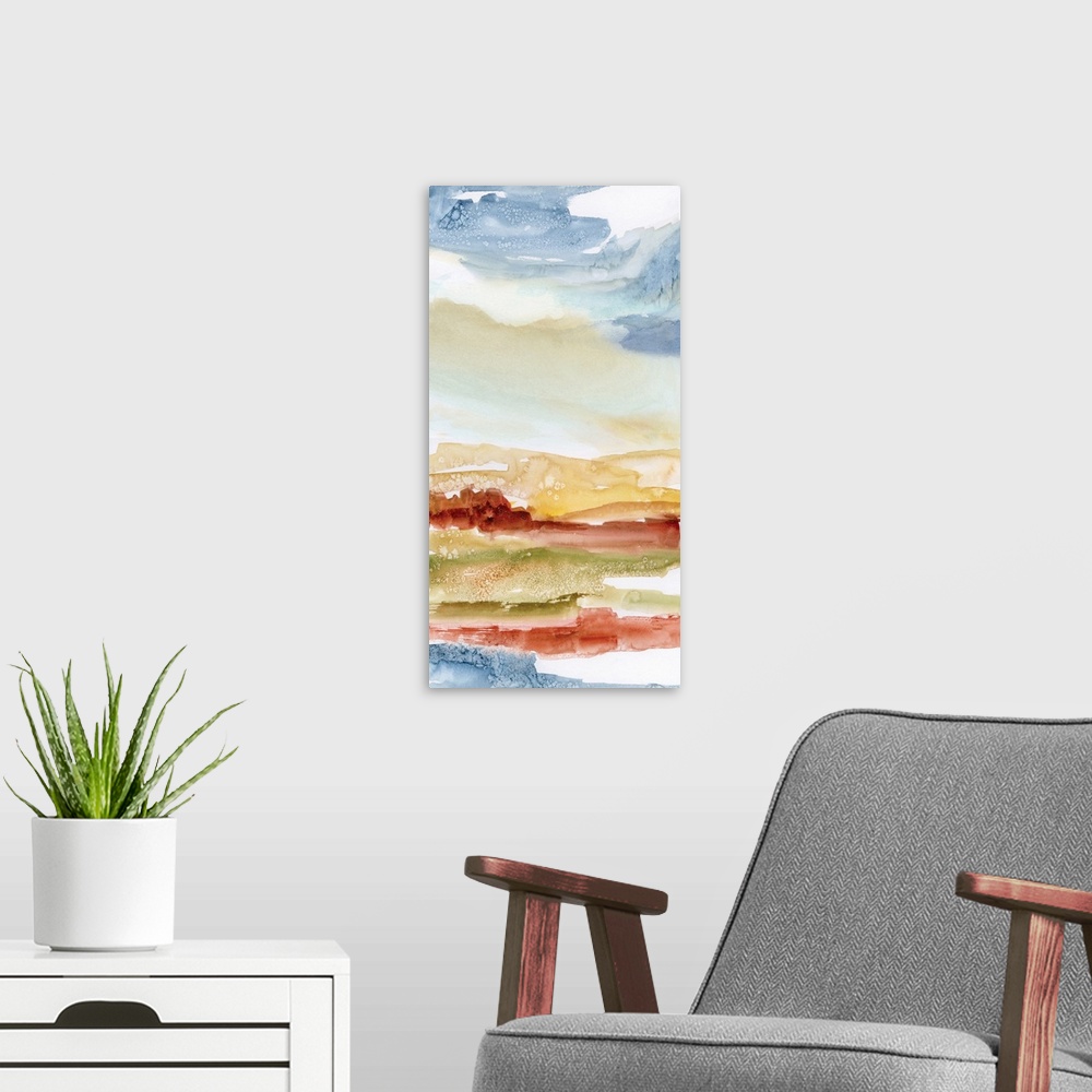 A modern room featuring Abstract watercolor painting in blue, red, and orange, resembling a desert landscape.