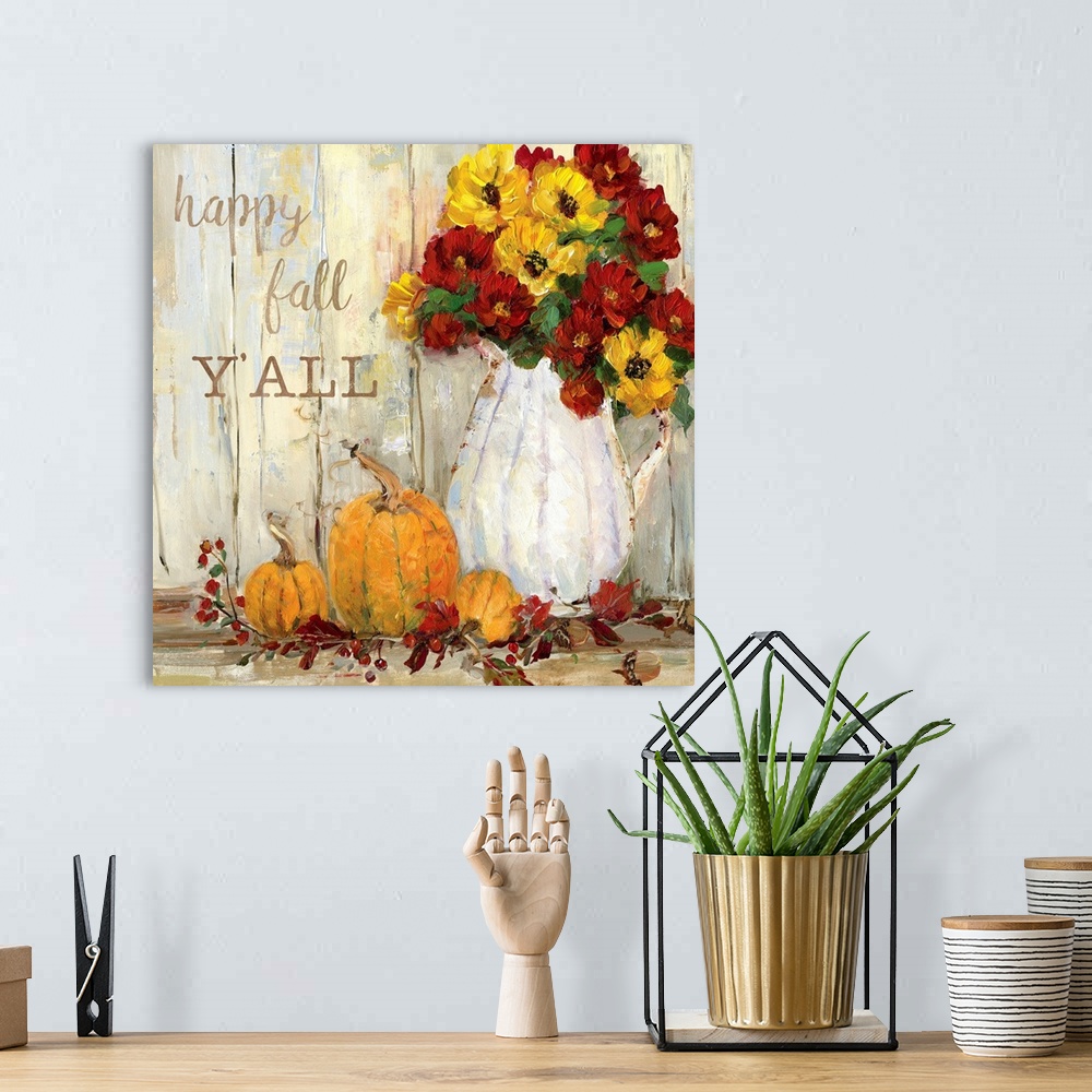 A bohemian room featuring "Happy Fall Y'all" written on a square canvas with illustrated pumpkins, flowers, acorns, and Fal...