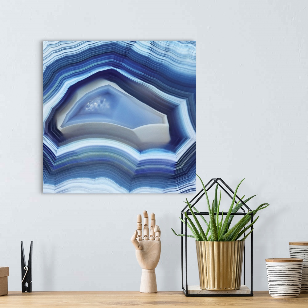 A bohemian room featuring Square agate art in shades of blue.