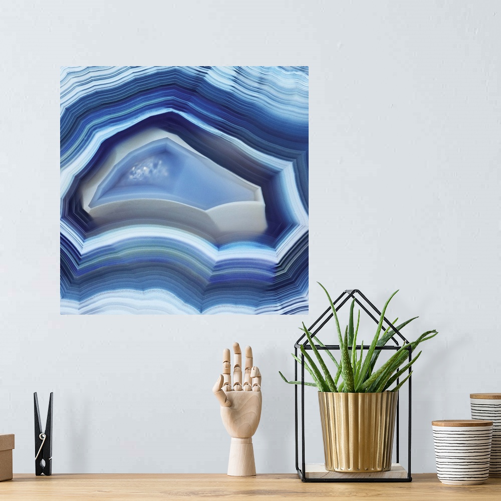 A bohemian room featuring Square agate art in shades of blue.