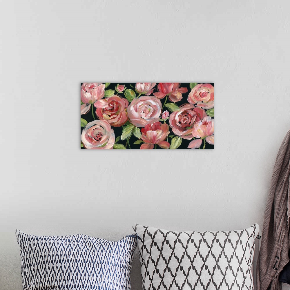 A bohemian room featuring A long horizontal painting of large pink/red roses and leaves on a black background.