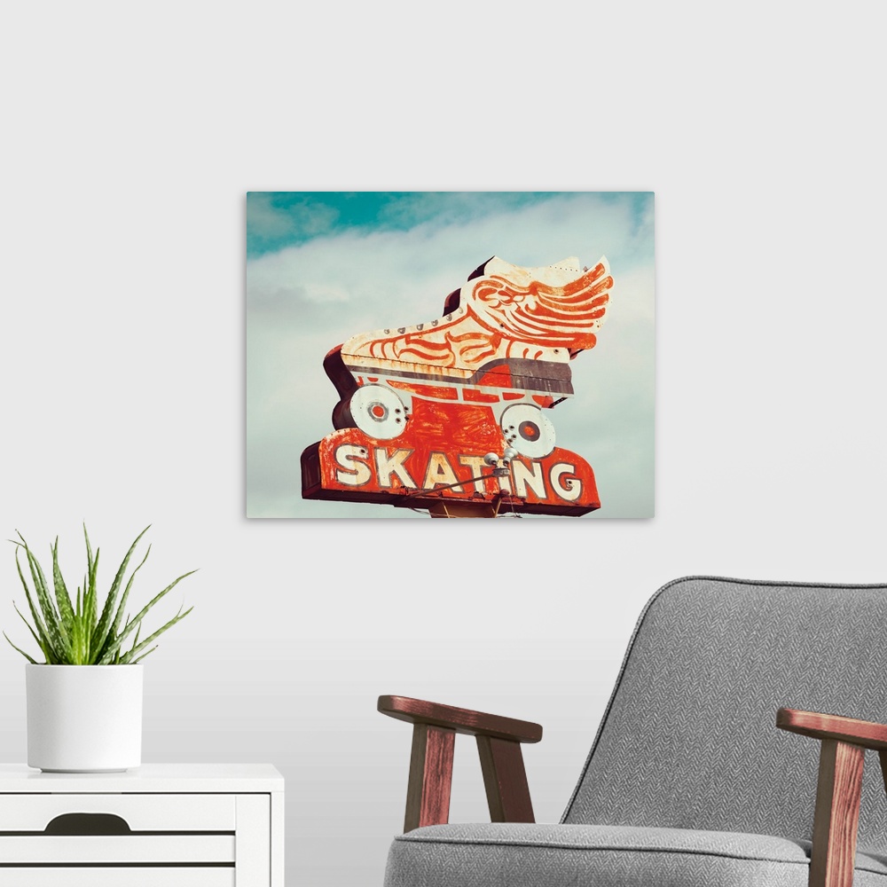 A modern room featuring Photograph of a vintage orange roller skating sign on a cloudy sky background.