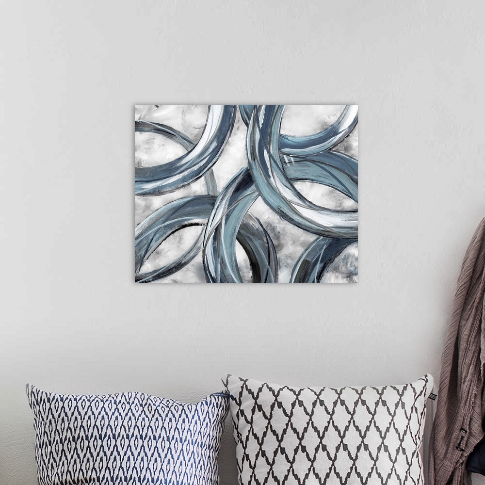 A bohemian room featuring Partially hidden rings of blue and gray brush strokes are displayed against a light background in...
