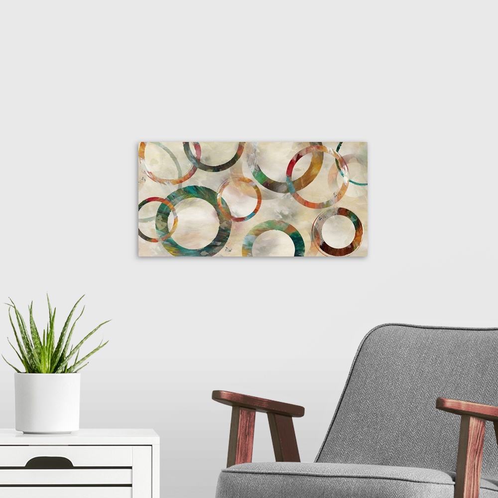 A modern room featuring Colorful textured painted rings in various thicknesses are arranged on neutral brushstrokes backd...