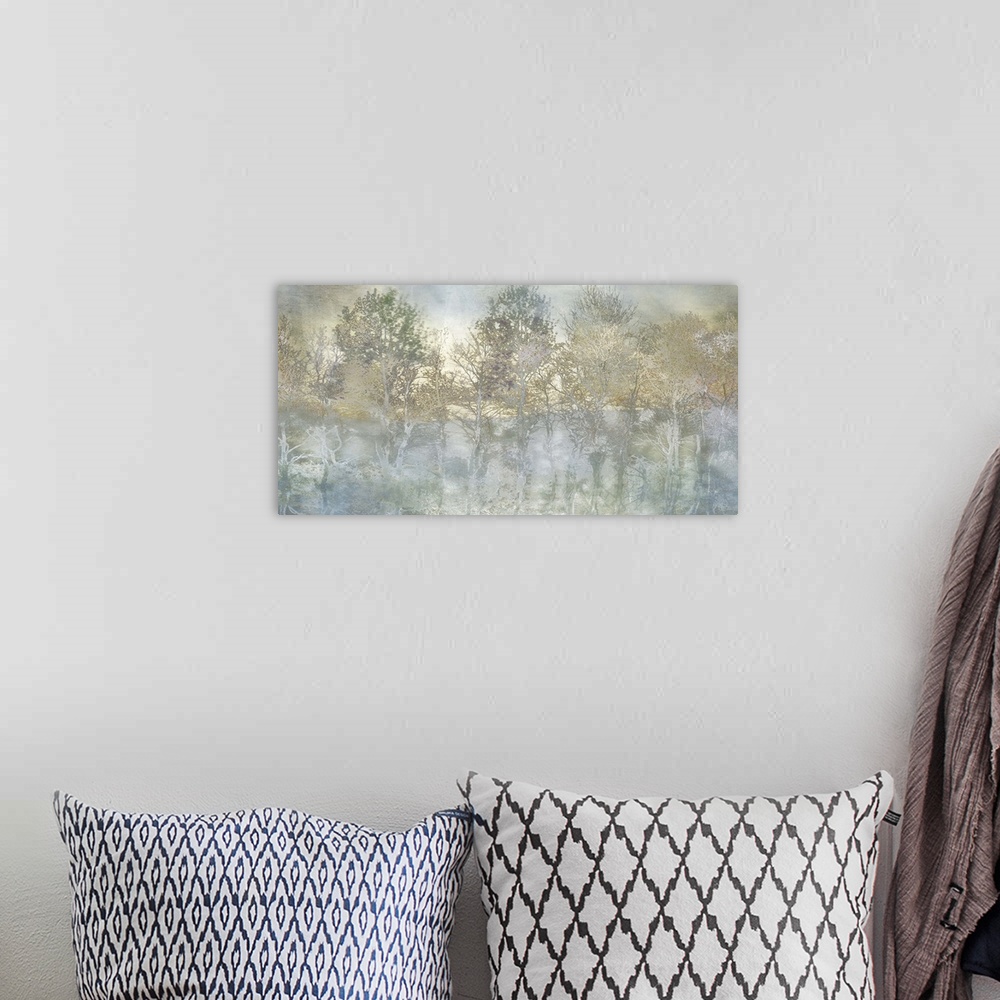 A bohemian room featuring Semi-abstract artwork of a forest of misty trees in shades of pale brown and blue.