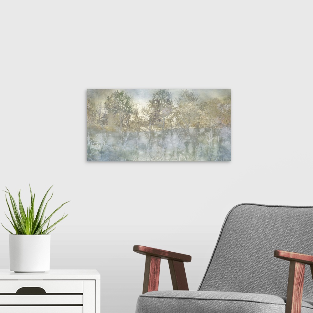 A modern room featuring Semi-abstract artwork of a forest of misty trees in shades of pale brown and blue.