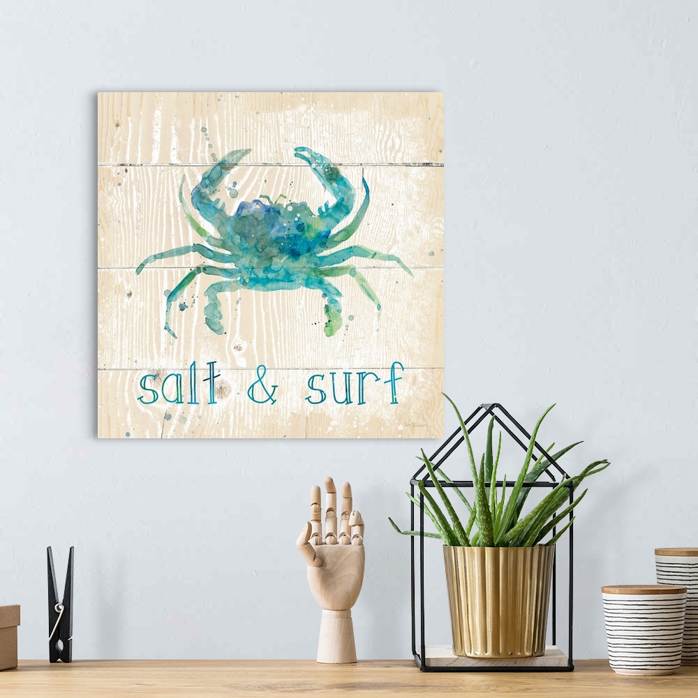 A bohemian room featuring A beach themed watercolor on a wooden background.