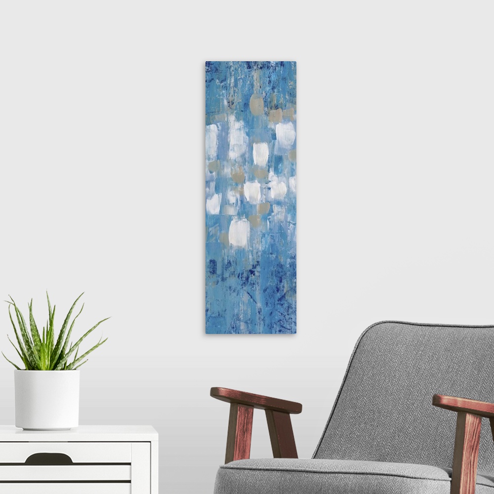 A modern room featuring Contemporary abstract painting in blue with white and grey shapes in the center.