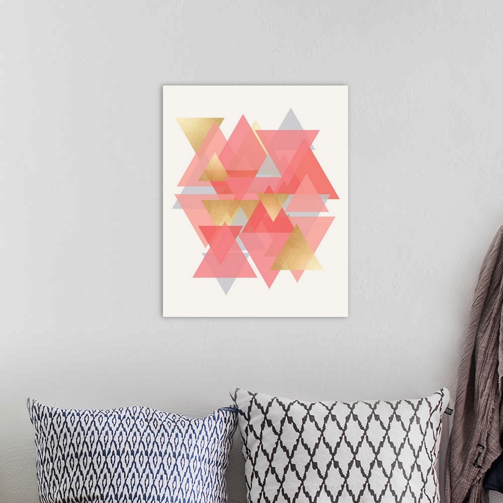 A bohemian room featuring A vertical geometric design of a group of overlapping triangles in pink and gold.