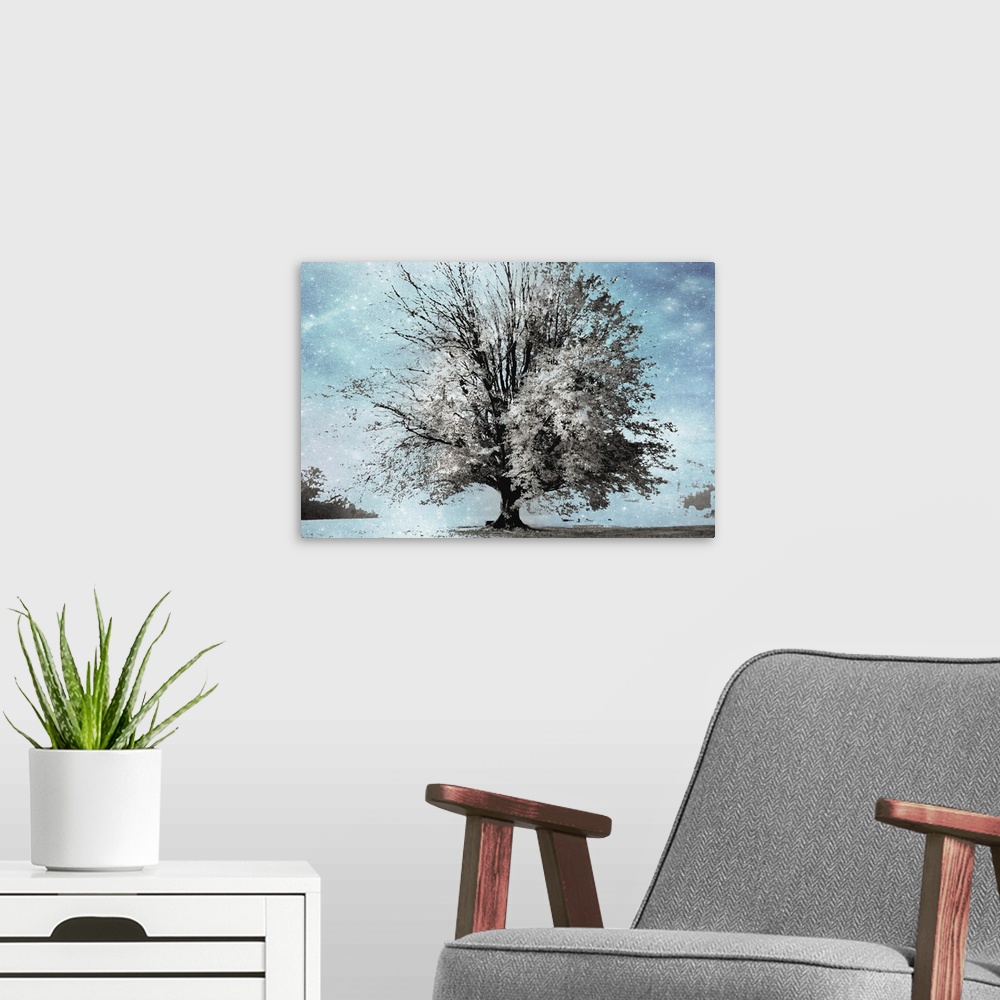 A modern room featuring Surreal photograph of a Winter tree in gray, white, and black tones composited on a blue starry b...