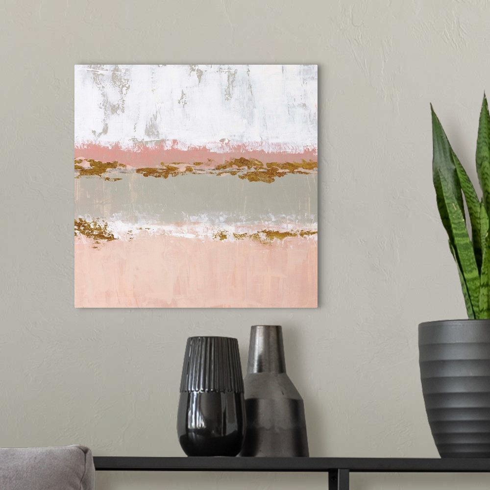 A modern room featuring Square abstract artwork made with horizontal sections in pale pink, gray, white, and metallic gol...