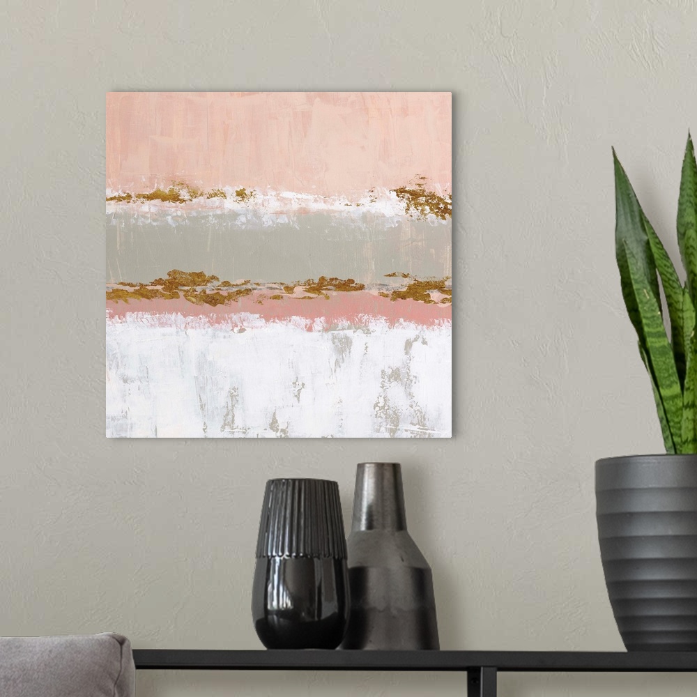 A modern room featuring Square abstract artwork made with horizontal sections in pale pink, gray, white, and metallic gol...