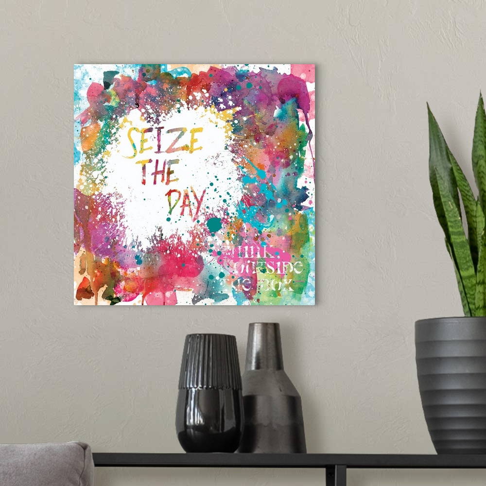 A modern room featuring Inspirational square painting with colorful paint splatter and the phrases "Seize The Day" and "T...