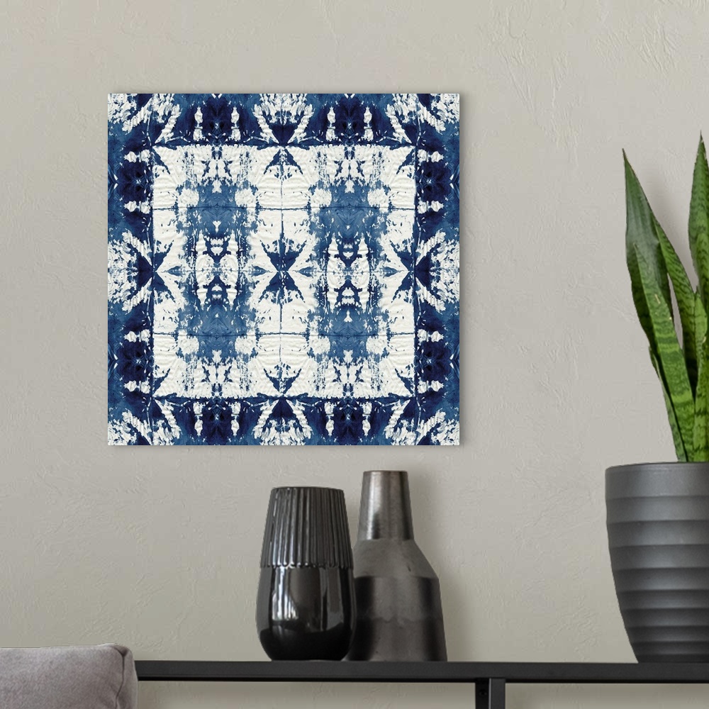 A modern room featuring Square shibori art with a pattern in indigo and white.