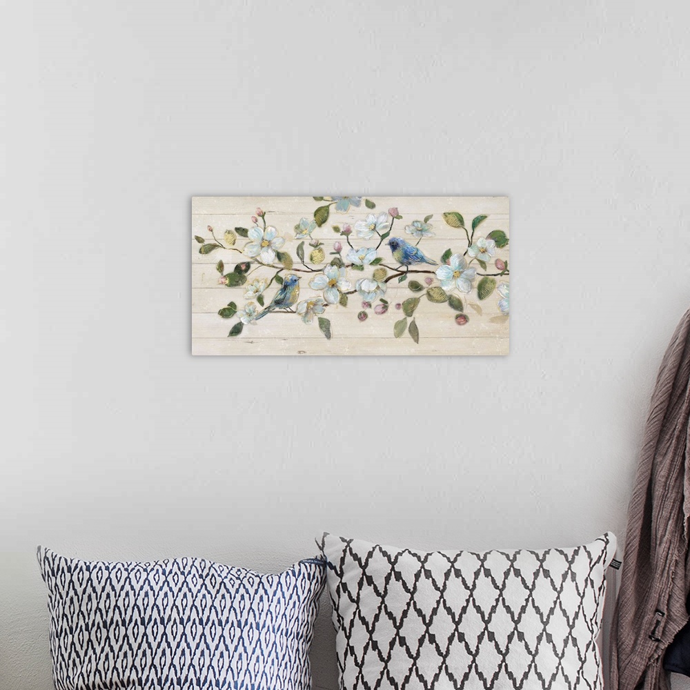 A bohemian room featuring A painting of two birds sitting on a branch surrounded by white flowers on a shiplap background.