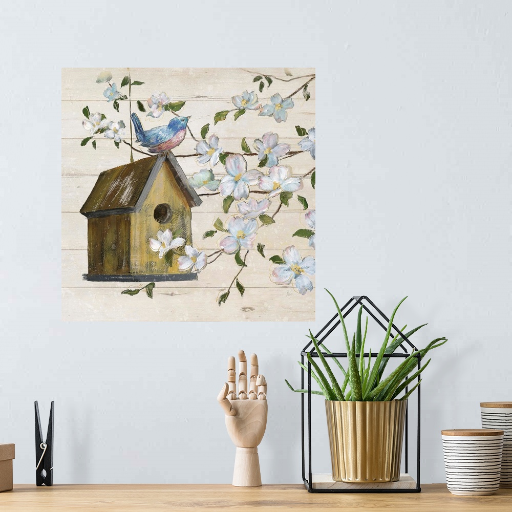 A bohemian room featuring A painting of a birdhouse hanging from a tree with a bird perched on top, surrounded with white f...