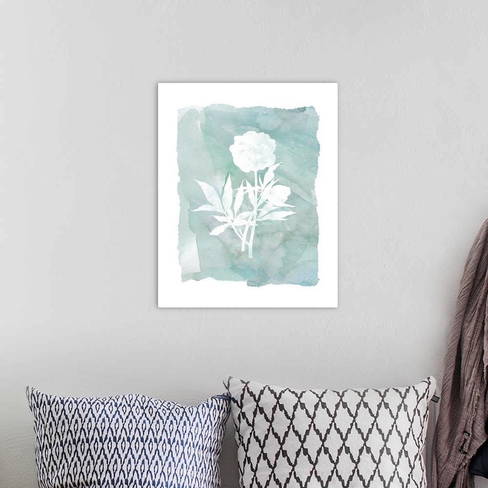 A bohemian room featuring A watercolor painting with white silhouettes of flowers and a blue-green background.