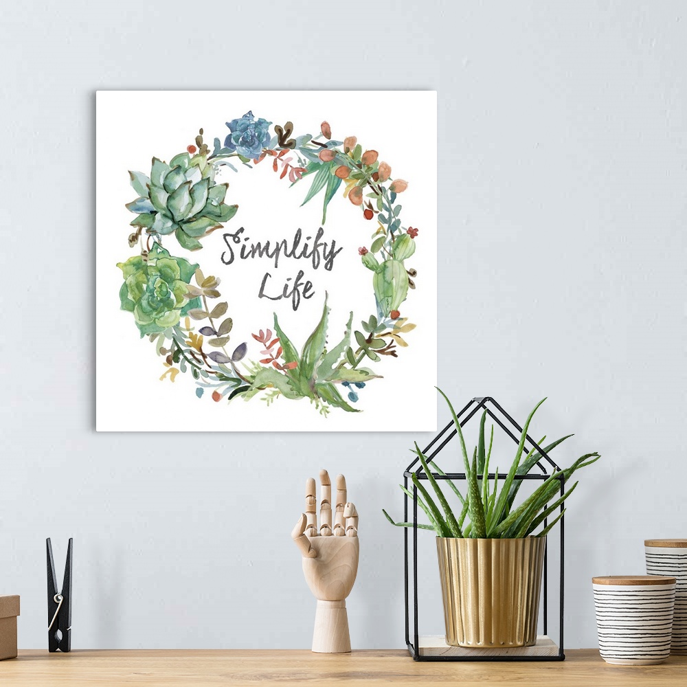 A bohemian room featuring Square watercolor painting of a wreath made out of succulents and colorful leaves with the phrase...