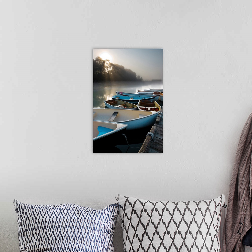 A bohemian room featuring Photograph of a cluster of boats docked on a lake with beautiful morning light peering through th...