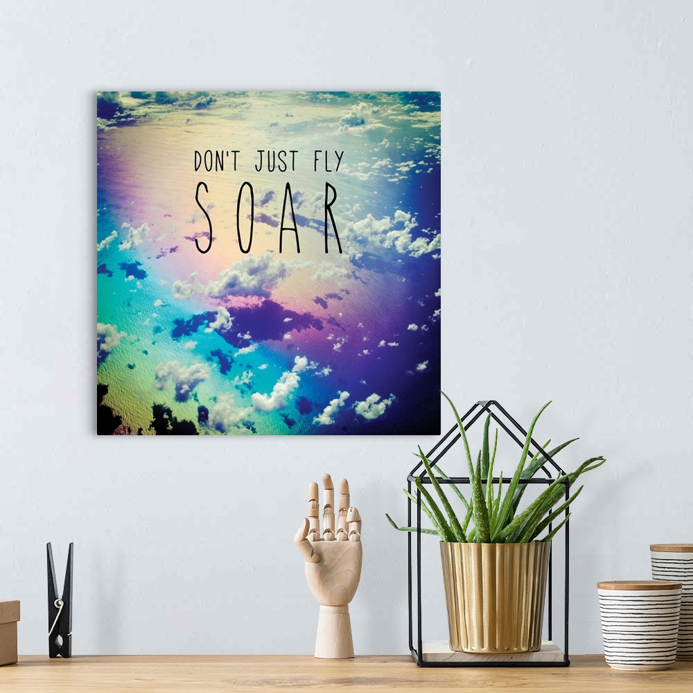 A bohemian room featuring Square photograph of clouds from a bird's eye view with a rainbow filter and the phrase "Don't Ju...