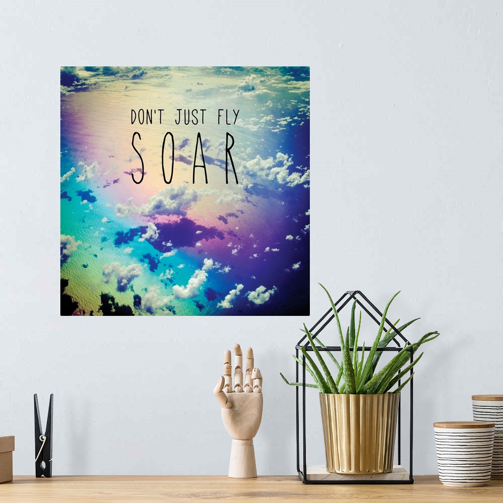 A bohemian room featuring Square photograph of clouds from a bird's eye view with a rainbow filter and the phrase "Don't Ju...