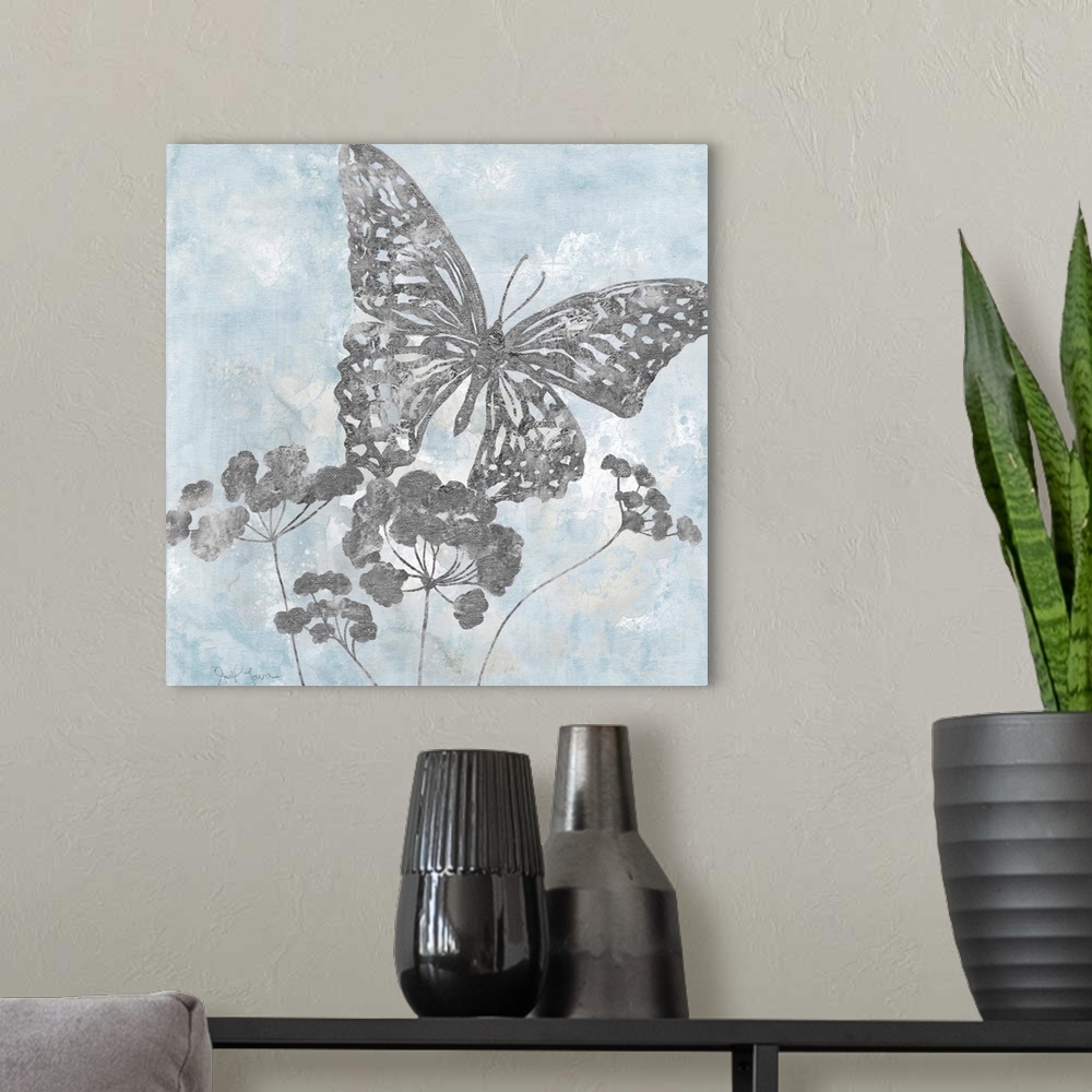 A modern room featuring Contemporary square painting of silver silhouettes of a butterfly and flowers with a light blue a...