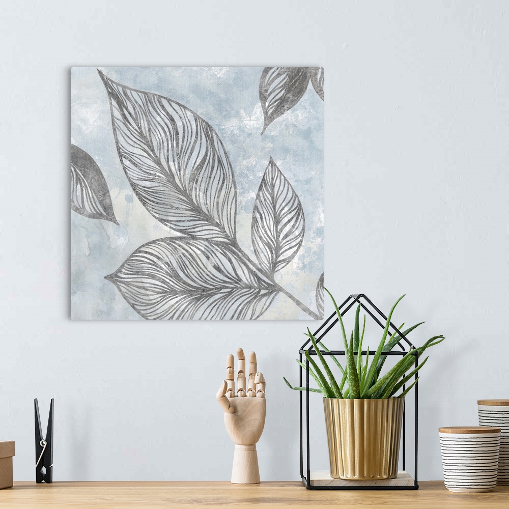 A bohemian room featuring Contemporary square painting of silver silhouettes of leaves with a light blue and white background.