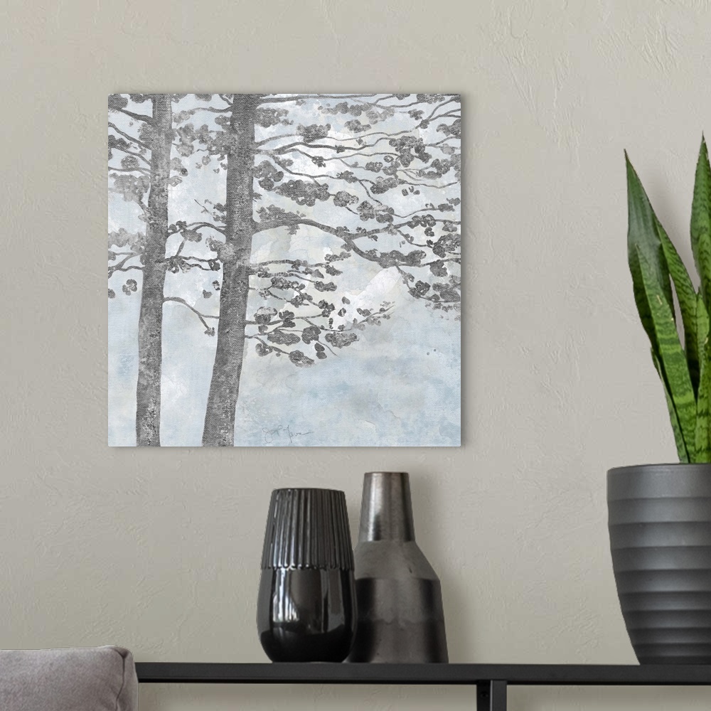 A modern room featuring Contemporary square painting of silver silhouettes of trees with a light blue and white background.