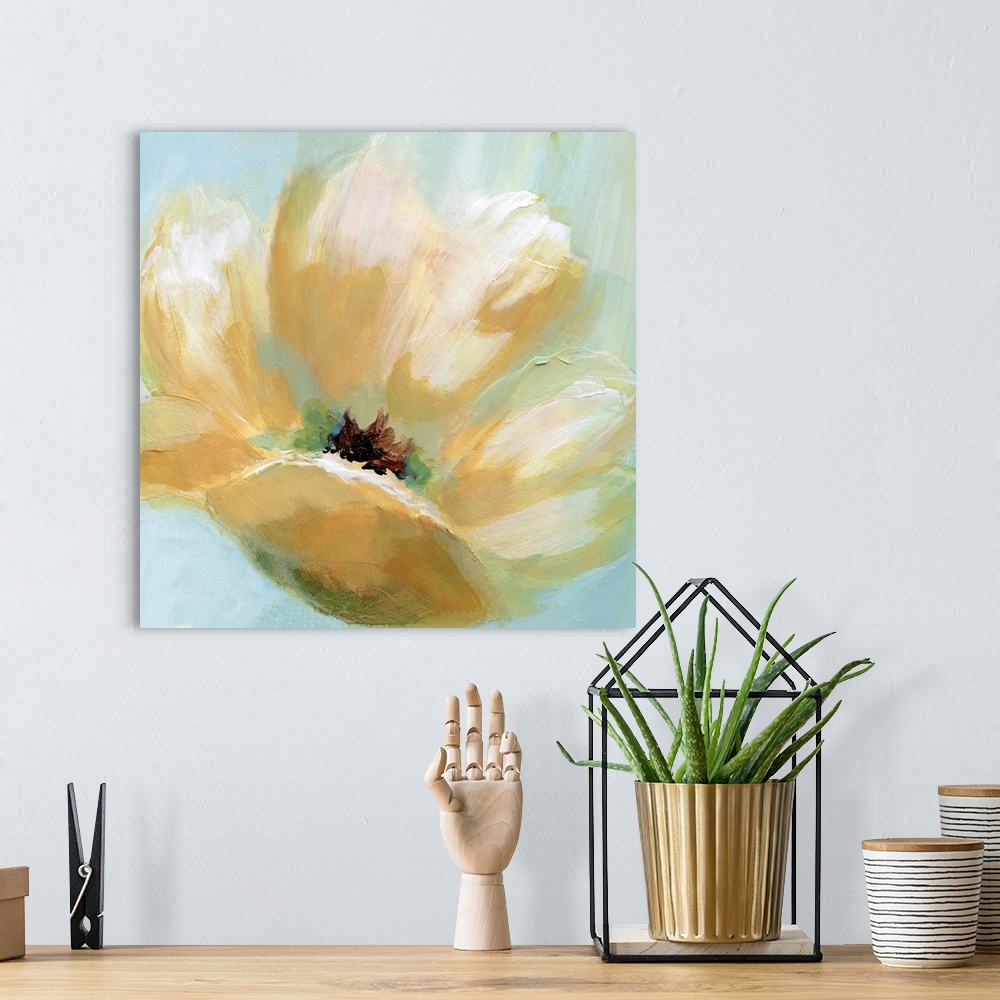 A bohemian room featuring Square painting of a yellow flower with cream highlights on a light blue and green background.