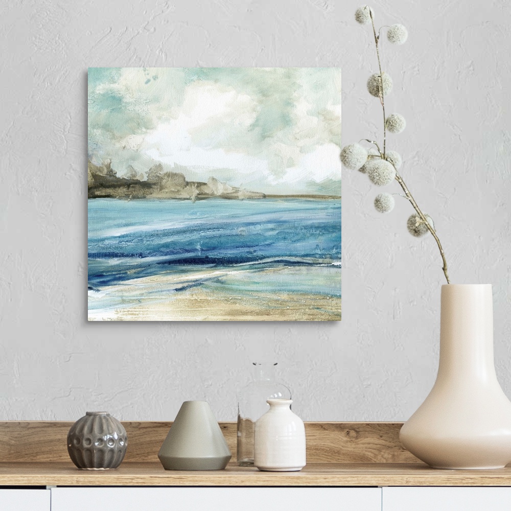 A farmhouse room featuring Abstract painting of the beach with layers of blue, gray, and white hues.
