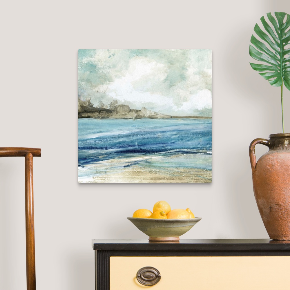 A traditional room featuring Abstract painting of the beach with layers of blue, gray, and white hues.