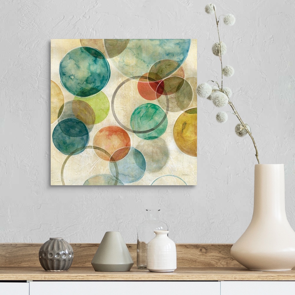 A farmhouse room featuring A contemporary abstract painting of various colored circles on canvas.