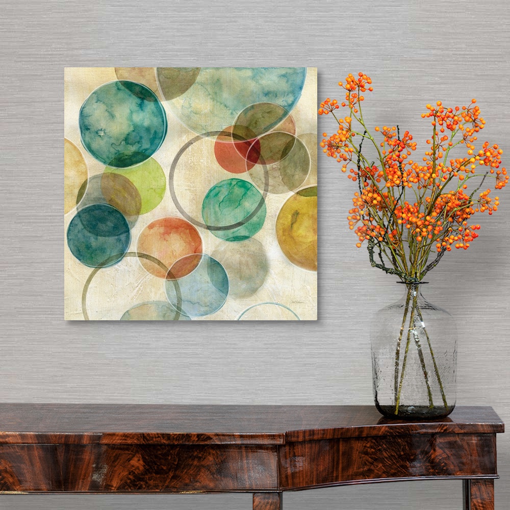 A traditional room featuring A contemporary abstract painting of various colored circles on canvas.