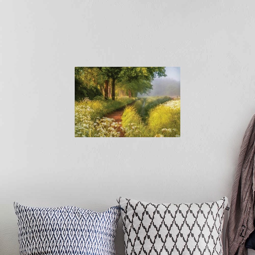 A bohemian room featuring A photo with a semblance of a painting displays a hidden pathway in a meadow during spring.